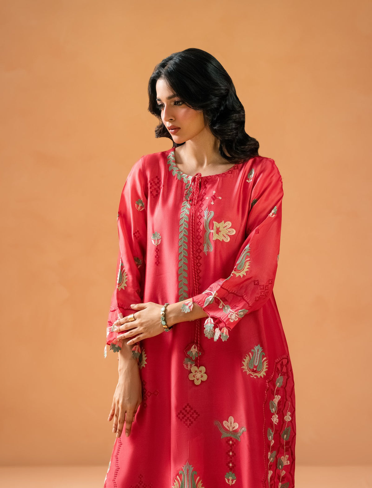 Melon Pink Kaftaan - embroidered placket and tasseled neckline close-up